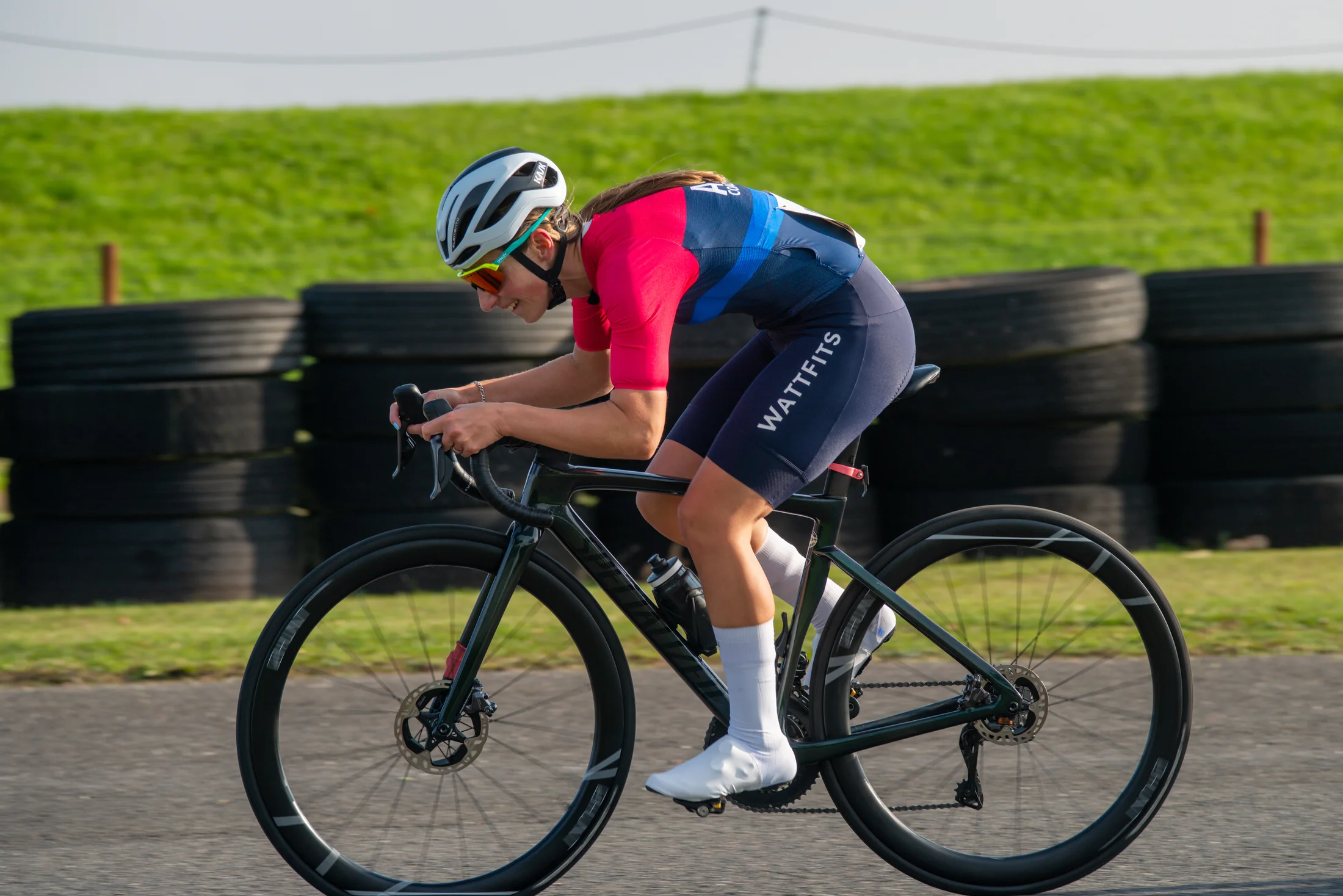 WattFits rider racing in custom cycling kit